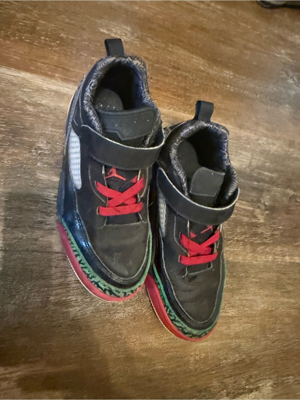 Nike Kids Black Sneakers with Red Laces and Green Accent